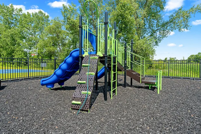 Community playground at Saddlebrook Apartments in Pewaukee, Wisconsin for outdoor recreation.