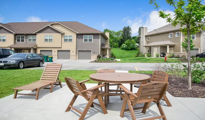 Outdoor lounge area at High Bluff Townhomes in Grafton, Wisconsin designed for resident gatherings.