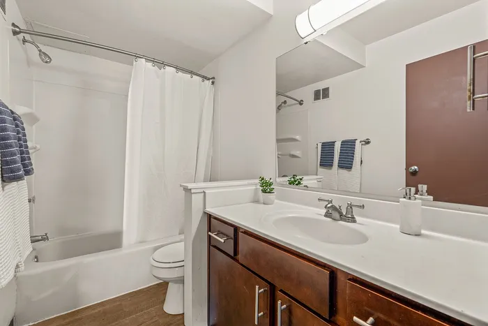 Bathroom at Fitchburg Square Apartments in Fitchburg, Wisconsin, featuring practical design within 1 bedroom and 2 bedroom apartment homes.