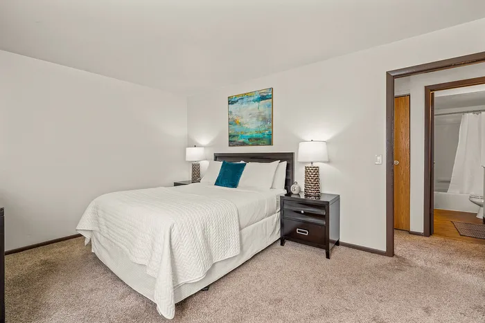 Bedroom at Fitchburg Square Apartments in Fitchburg, Wisconsin, offering comfortable sleeping space within 1 bedroom and 2 bedroom apartment layouts.