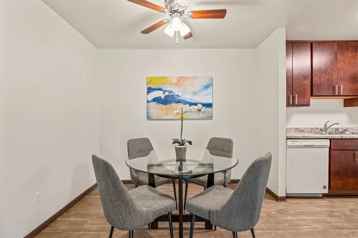 Dining room area at Fitchburg Square Apartments in Fitchburg, Wisconsin, offering comfortable space for everyday meals within 1 bedroom and 2 bedroom apartments.
