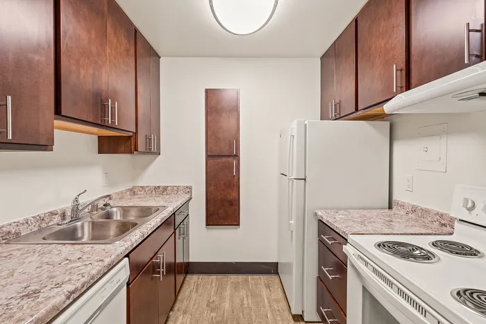 Kitchen interior at Fitchburg Square Apartments in Fitchburg, Wisconsin, featuring functional layouts designed for 1 bedroom and 2 bedroom apartment homes.