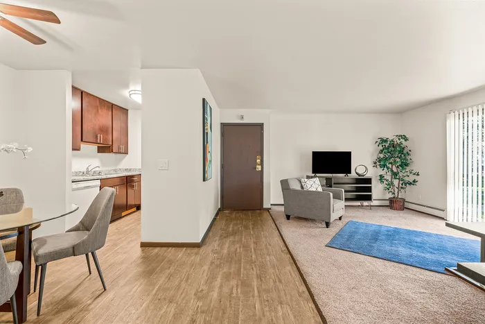 Living room at Fitchburg Square Apartments in Fitchburg, Wisconsin, showcasing open living space in 1 bedroom and 2 bedroom apartment homes.