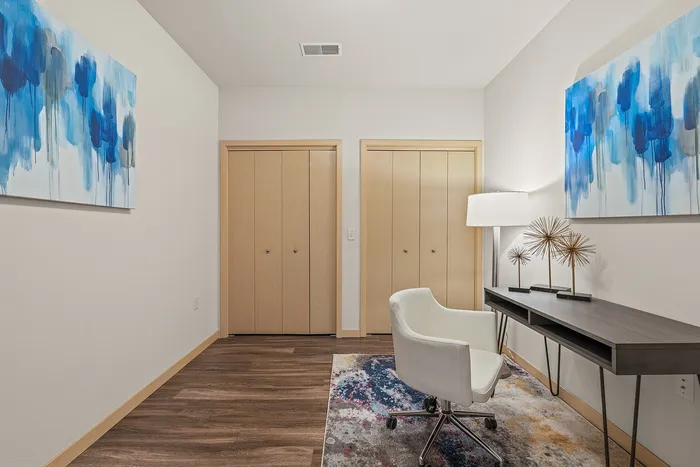 Apartment den at Elan Apartments in Fitchburg, Wisconsin offering flexible space for work or relaxation.