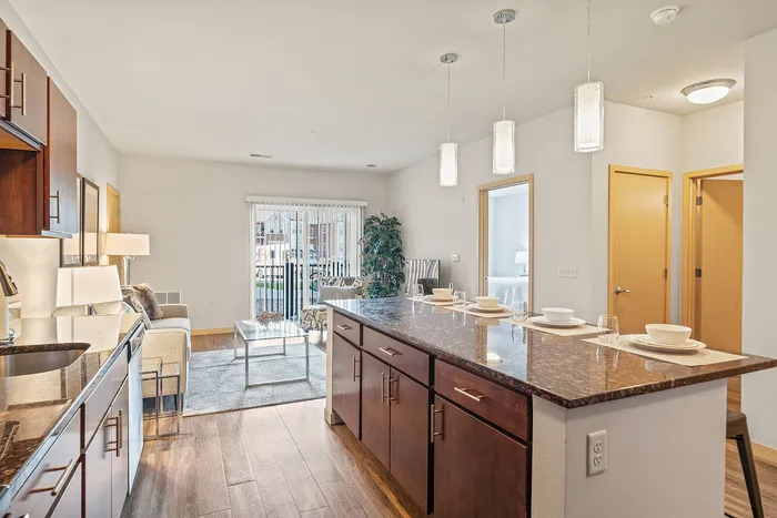 Apartment kitchen at Elan Apartments in Fitchburg, Wisconsin featuring modern finishes and appliances.