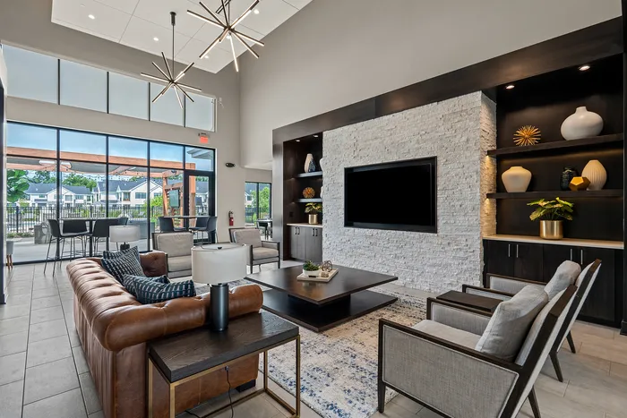 Clubhouse interior at Seasons at Franklin Apartments in Franklin, Wisconsin offering shared spaces for relaxing, working, and socializing.