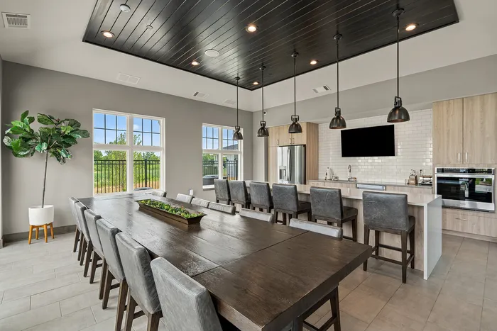 Clubhouse interior at Seasons at Franklin Apartments in Franklin, Wisconsin offering shared spaces for relaxing, working, and socializing.