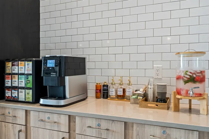 Complimentary coffee bar at Seasons at Franklin Apartments in Franklin, Wisconsin located within the clubhouse for resident use.