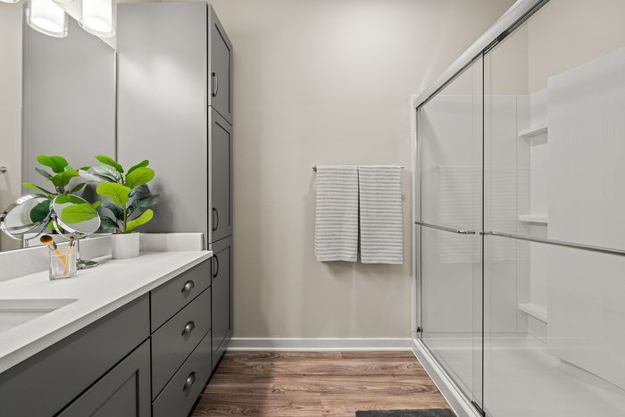Bathroom at Seasons at Franklin Apartments in Franklin, Wisconsin featuring clean finishes and functional vanity space.