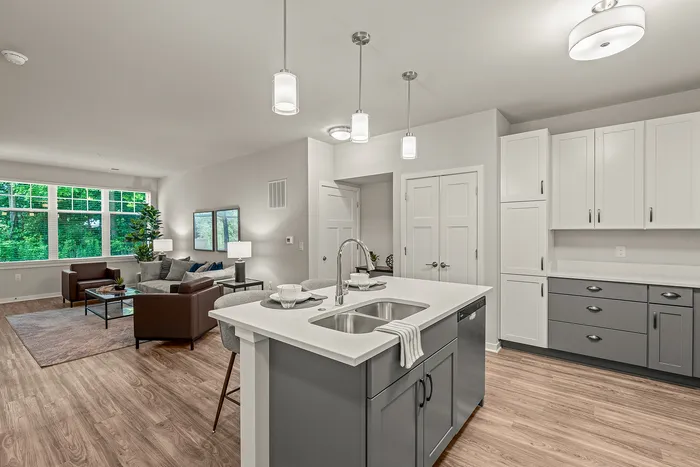 Kitchen at Seasons at Franklin Apartments in Franklin, Wisconsin featuring ample cabinet storage, updated appliances, and functional layout.