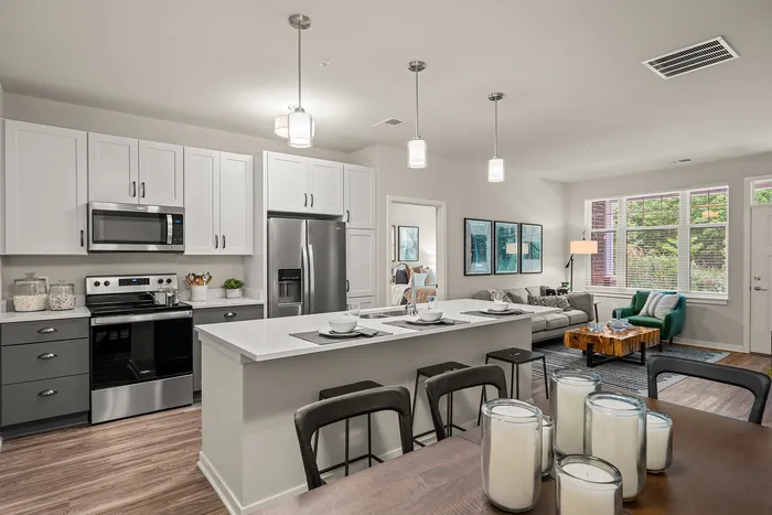 Kitchen at Seasons at Franklin Apartments in Franklin, Wisconsin featuring ample cabinet storage, updated appliances, and functional layout.