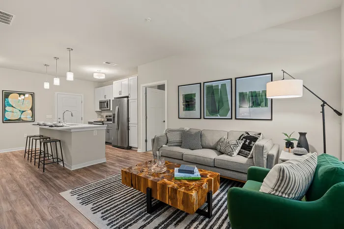 Living room at Seasons at Franklin Apartments in Franklin, Wisconsin offering open layouts and natural light.