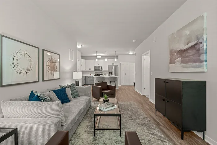 Living room at Seasons at Franklin Apartments in Franklin, Wisconsin offering open layouts and natural light.