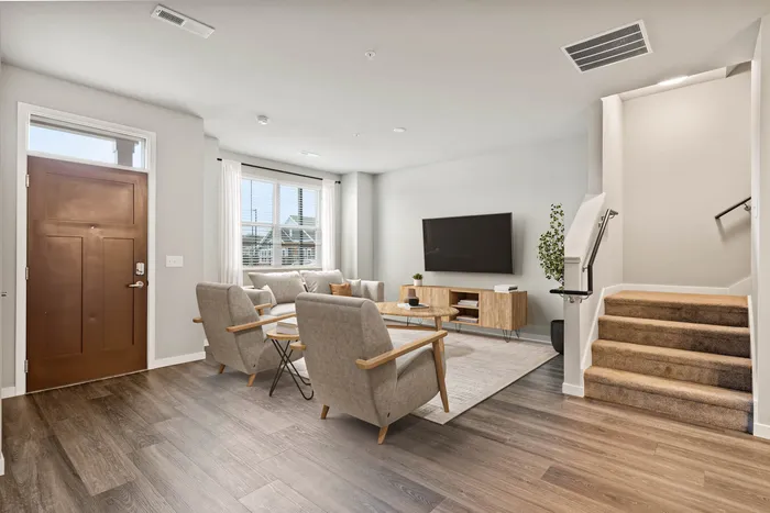 Townhome living room at The 85 at Maple Grove with open-concept layout in Madison, Wisconsin.