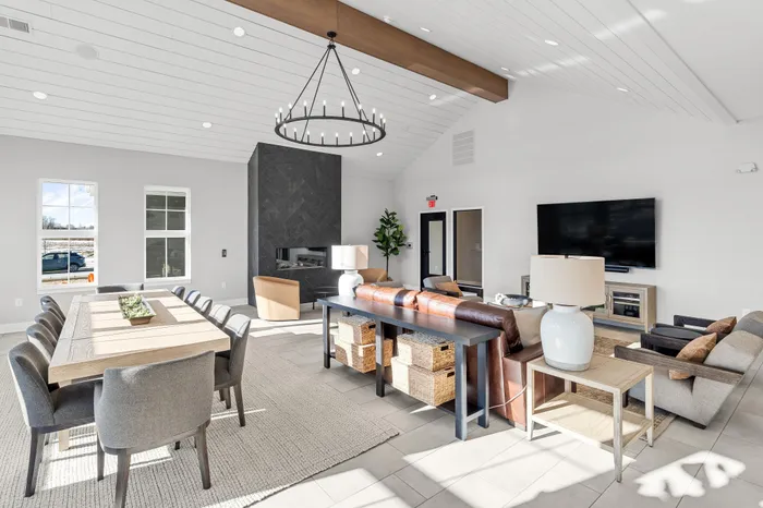 Modern clubhouse interior with lounge and kitchen space at Apex at Verona in Verona, WI