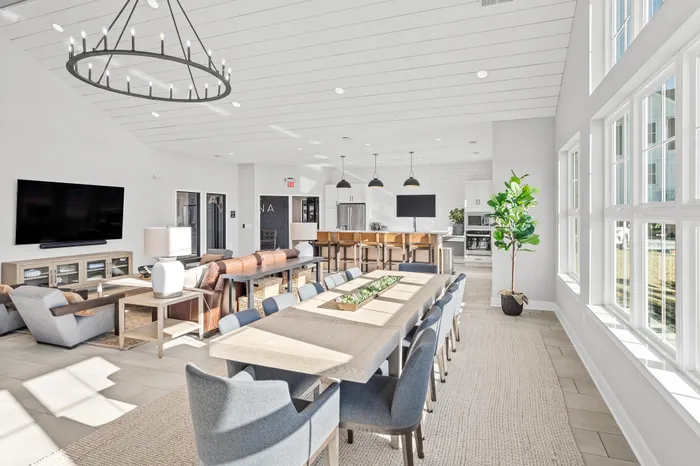Modern clubhouse interior with lounge and kitchen space at Apex at Verona in Verona, WI