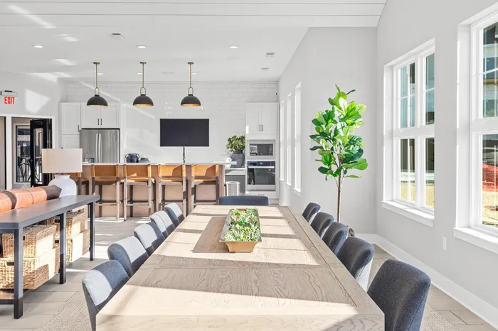 Modern clubhouse interior with lounge and kitchen space at Apex at Verona in Verona, WI