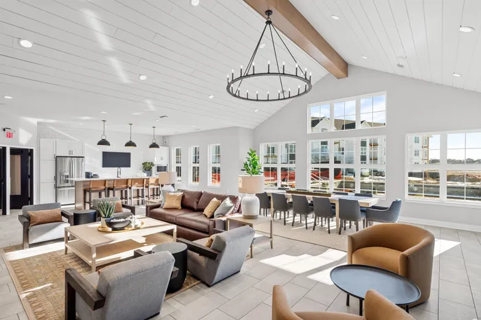 Modern clubhouse interior with lounge and kitchen space at Apex at Verona in Verona, WI