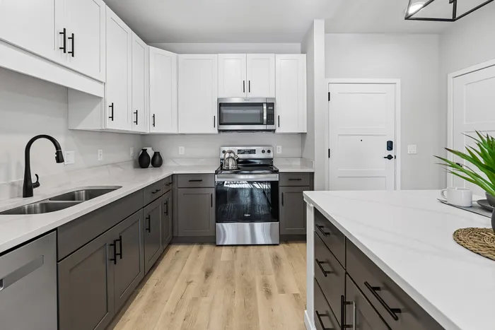 Modern apartment kitchen with contemporary finishes at Apex at Verona in Verona, WI