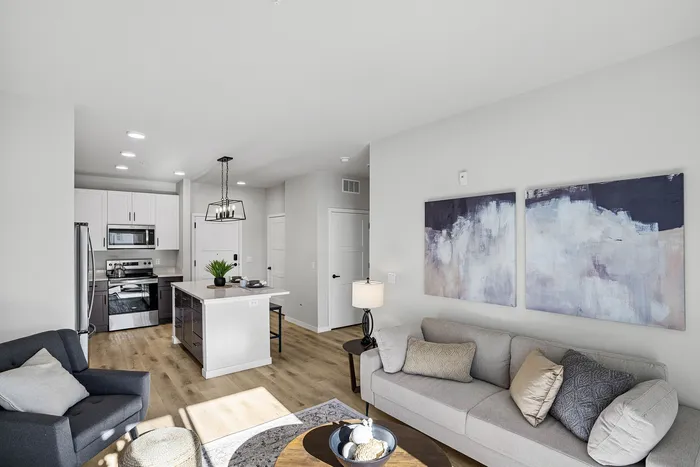 Open-concept apartment living room with modern finishes at Apex at Verona in Verona, WI