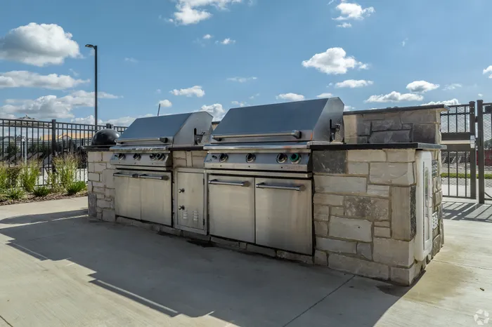 Outdoor grilling station at Seasons at Elgin Apartments in Elgin, Illinois for resident use.
