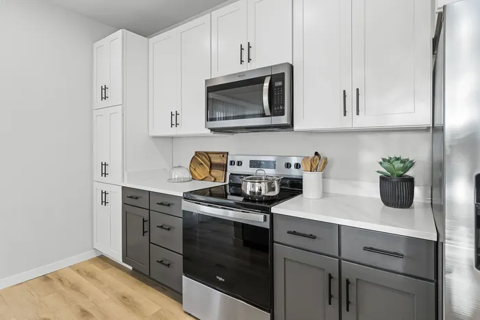 Kitchen at Seasons at Elgin Apartments in Elgin, Illinois featuring ample cabinet storage, updated appliances, and functional counter space.