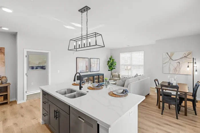 Kitchen at Seasons at Elgin Apartments in Elgin, Illinois featuring ample cabinet storage, updated appliances, and functional counter space.