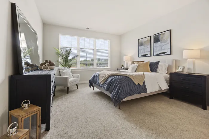Bedroom at Seasons at Elgin Apartments in Elgin, Illinois offering generous space and natural light.