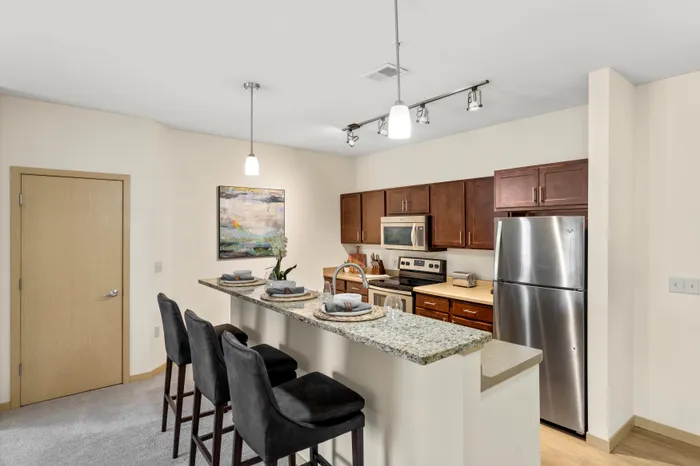 Kitchen at The Woodlands at North Hills featuring functional layouts and ample cabinet space.