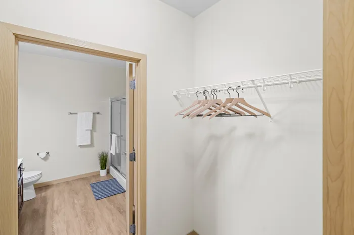 Walk-in closet at The Woodlands at North Hills providing convenient storage space.