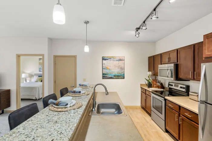 Kitchen at The Woodlands at North Hills featuring functional layouts and ample cabinet space.