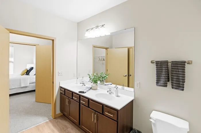 Bathroom at The Woodlands at North Hills with clean finishes and practical storage.
