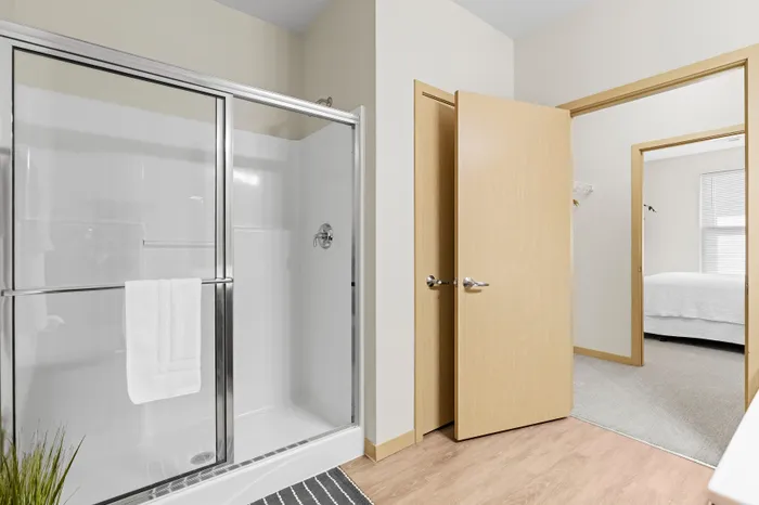 Bathroom at The Woodlands at North Hills with clean finishes and practical storage.