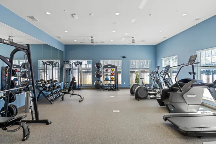 Fitness center at Seasons at Grafton Apartments in Grafton, Wisconsin equipped for a variety of workout routines.