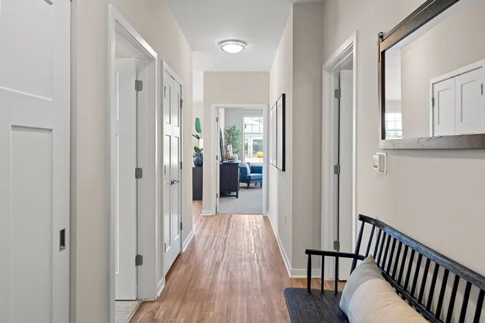 Interior hallway at Seasons at Grafton Apartments in Grafton, Wisconsin connecting living spaces within the apartment home.