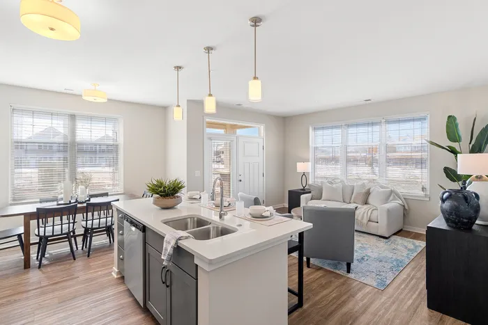 Kitchen at Seasons at Grafton Apartments in Grafton, Wisconsin featuring spacious layouts, modern cabinetry, and functional prep space.