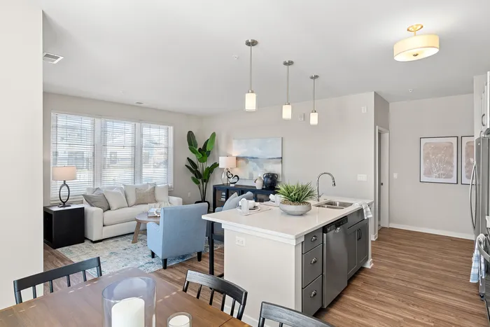 Kitchen at Seasons at Grafton Apartments in Grafton, Wisconsin featuring spacious layouts, modern cabinetry, and functional prep space.
