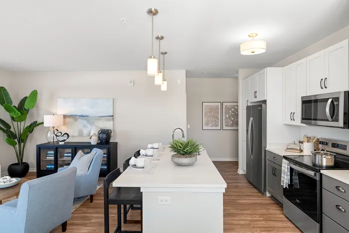 Kitchen at Seasons at Grafton Apartments in Grafton, Wisconsin featuring spacious layouts, modern cabinetry, and functional prep space.