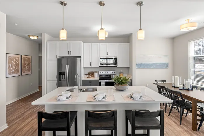Kitchen at Seasons at Grafton Apartments in Grafton, Wisconsin featuring spacious layouts, modern cabinetry, and functional prep space.