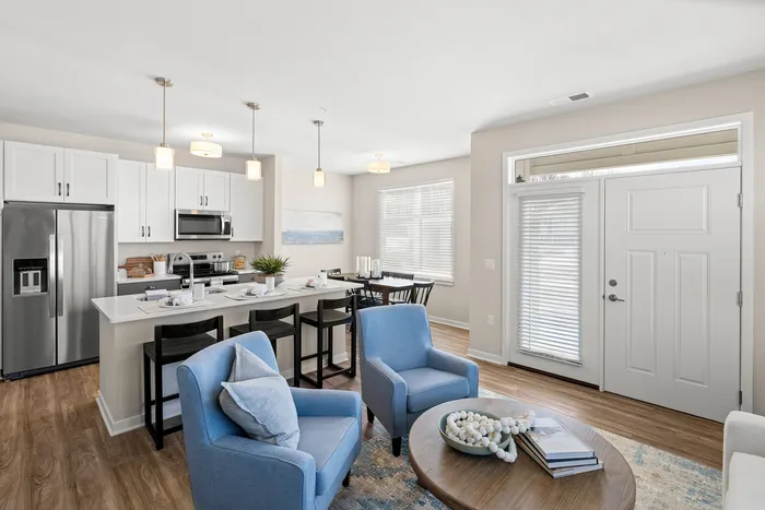Living room at Seasons at Grafton Apartments in Grafton, Wisconsin featuring open layouts and comfortable living space.