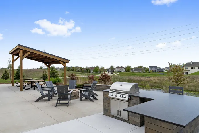 Outdoor lounge area at High Bluff Townhomes in Grafton, Wisconsin designed for resident gatherings.