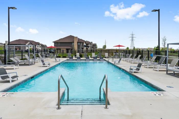 Resort-style swimming pool at High Bluff Townhomes in Grafton, Wisconsin offering outdoor relaxation for residents.