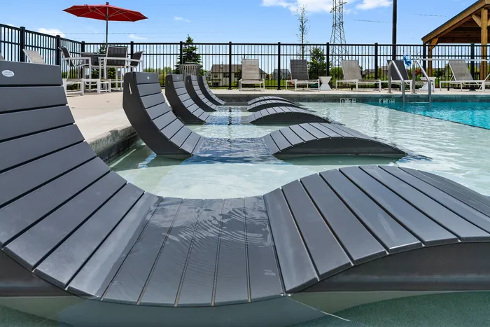 Resort-style swimming pool at High Bluff Townhomes in Grafton, Wisconsin offering outdoor relaxation for residents.