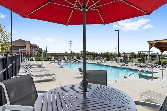 Resort-style swimming pool at High Bluff Townhomes in Grafton, Wisconsin offering outdoor relaxation for residents.