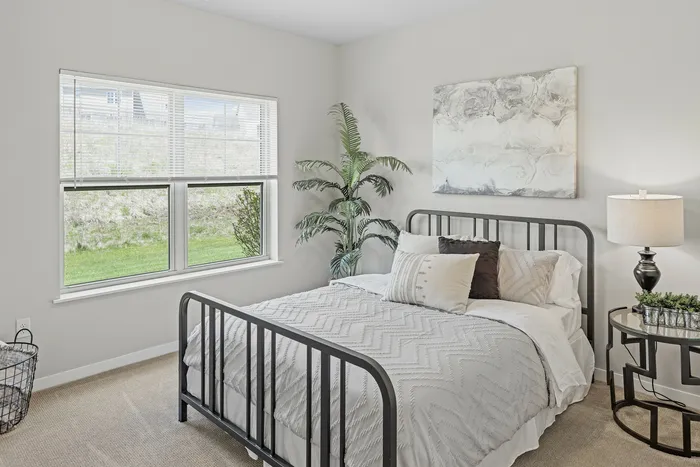 Bedroom at High Bluff Townhomes in Grafton, Wisconsin offering comfortable living space.