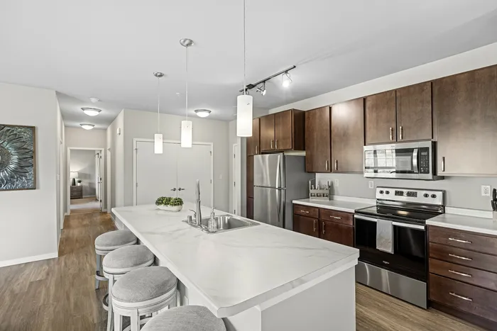 Apartment kitchen at High Bluff Townhomes in Grafton, Wisconsin featuring modern finishes and layouts.
