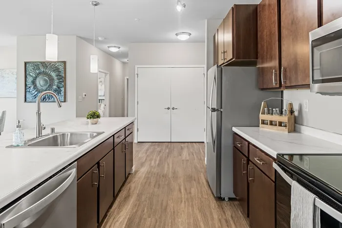 Apartment kitchen at High Bluff Townhomes in Grafton, Wisconsin featuring modern finishes and layouts.