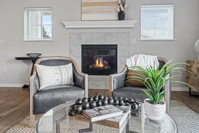 Living room at High Bluff Townhomes in Grafton, Wisconsin with open layouts and natural light.