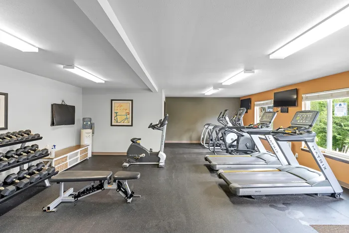 Fitness center at Arbor Lakes Apartments in Middleton, Wisconsin, equipped for resident workouts.