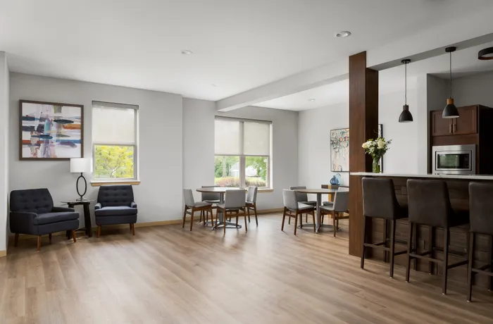 Clubroom at The Woodlands at North Hills offering comfortable seating and flexible community space.